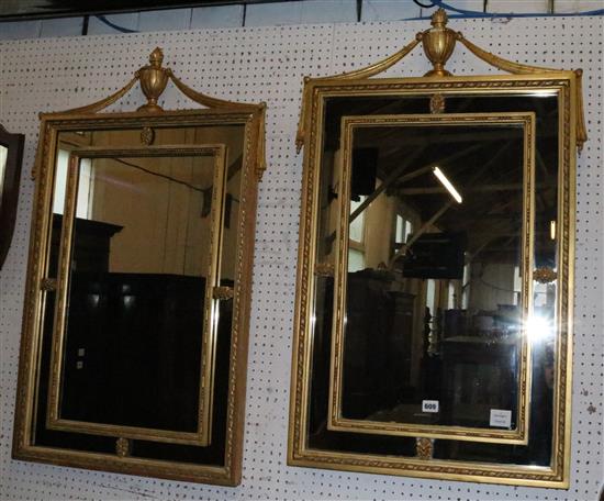 Pair of gilt marginal framed wall mirrors with urn and drapery swag pediments